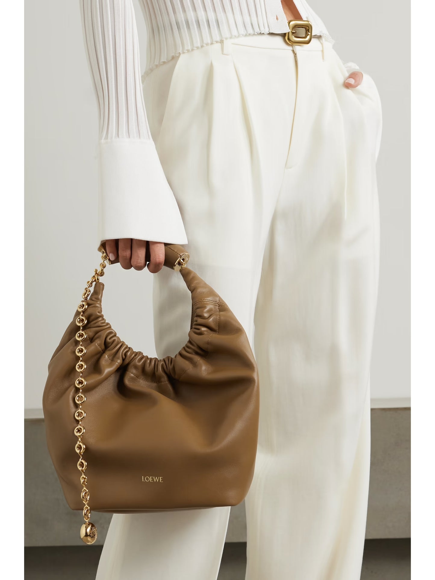 Loewe squeeze small tan leather handbag with gold hardware model holding top handle